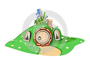 Fairytale forest house under a hill with a round door