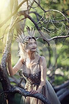 Fairytale girl in the branches of a tree
