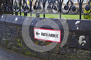 Faith Avenue Road Sign Leading To Church For Religious Worship