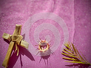 Lent Season,Holy Week and Good Friday concepts - image of cross,crown of thorns and palm leave in purple vintage background photo