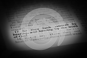 Faith Comes by Hearing Bible Scripture Illuminated on Page photo