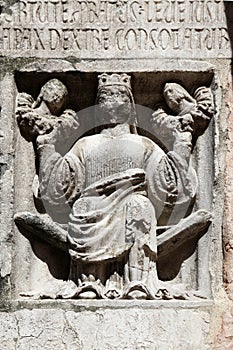 Faith holding Justice and Peace relief at the baptistry from Parma