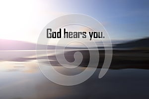 Faith quote - God hears you. Believe in God concept with sunset over the smooth water background on sea. Spirituality. photo