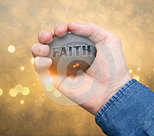 Faith stone in hand