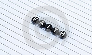 Faith word written with small black circles isolated on white lined paper