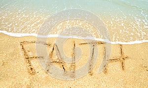 Faith written in sand photo
