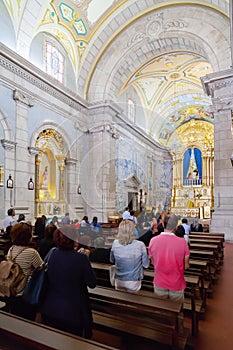 Faithful praying in the interior of the Sanctuary of Sao Bento da Porta Aberta