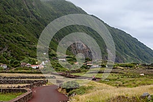 Fajã da Caldeira de Santo Cristo, a small inhabited headland on the island of Sao Jorge, Azores