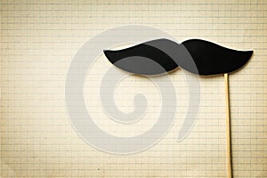 Fake black mustache.