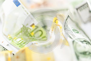 Fake dollars and euro crumpled money background