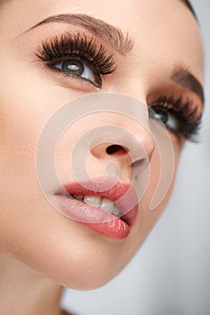 Fake Eyelashes. Beautiful Woman With Makeup And Beauty Face