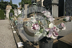 Fake flowers on gravestone