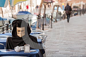 A fake mask have breakfast in venice