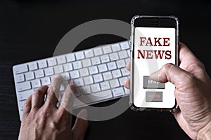 Fake news concept. Person finds false news on the internet and forwards its content from his smartphone