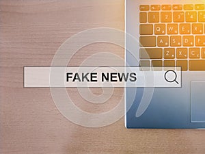 Fake news on internet hologram of the future on laptop background