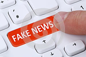 Fake news truth lie media internet button online finger computer photo