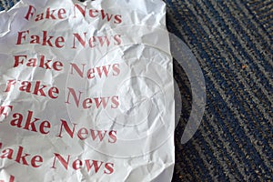 Fake news written in white paper