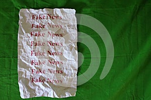 Fake news written in white paper