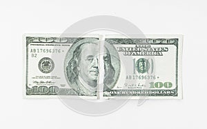 Ripped dollar bill isolated on white background