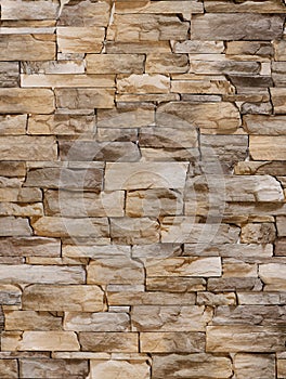 A fake stone in the form of a sharp bumpy coffee-colored tile