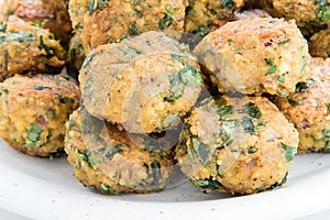 Falafel balls on white plate, close-up