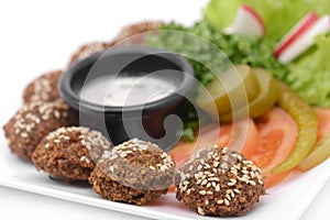 Falafel dish with veggies closeup photo