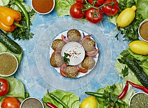 Falafel served on a plate on colorful background