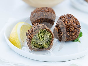 Falafel on white plate with lemon