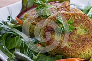 Falafels served on a green salad