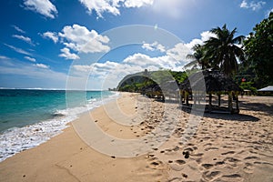 Fale`s on a white sand beach at Lalomanu, Samoa