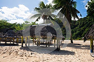 Fale`s on a white sand beach at Lalomanu, Samoa