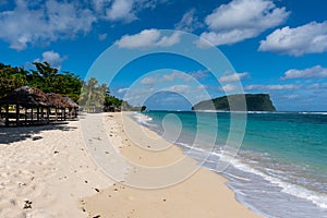 Fale`s on a white sand beach at Lalomanu, Samoa