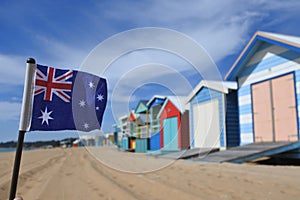 Falg of Australia flying beside the Iconic Bathing Boxes of the Mornington Peninsula Victoria Australia