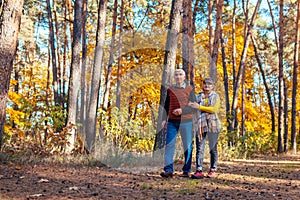 Fall activities. Senior family couple walking in autumn park. Man and woman chilling outdoors enjoying nature