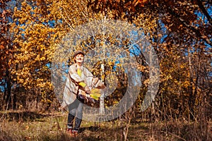 Fall activities. Woman running in autumn park. Senior woman having fun outdoors