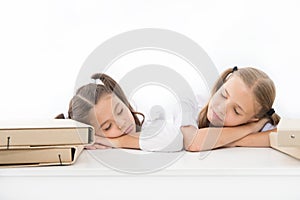 Fall asleep on lesson. Girls fall asleep while work school project white background. Schoolgirls tired of studying. Kids