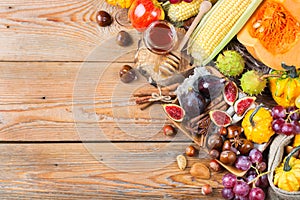 Fall autumn harvest background with pumpkin apple chestnut corn