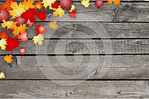 Fall, autumn leaves in corner, wooden background