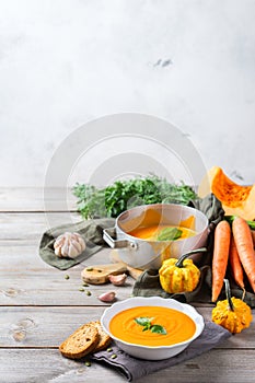 Fall autumn roasted orange pumpkin carrot soup with garlic