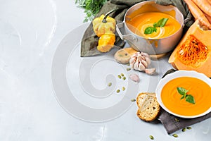 Fall autumn roasted orange pumpkin carrot soup with garlic