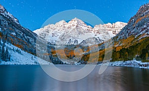 Fall color at Maroon lake at night after snow in Aspen, Colorado