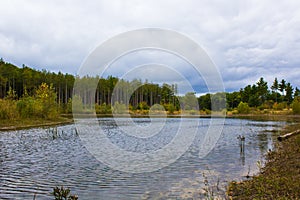 Fall color over lake at Riley Trail in Holland, Michigan