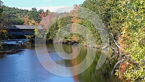 Fall colors around the henniker covered bridge and the contoocook river