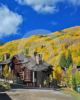 Fall Colors in Colorado rise over a lodge