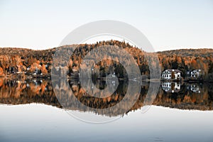 Fall colors of houses on the Lake and Mountain