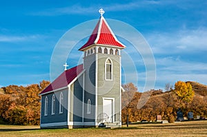 Fall colors surrounding St. Nicholas Anglican Church, near Craven, Saskatchewan, Canada