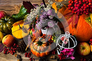 Fall decor with birdcage, apples and flowers