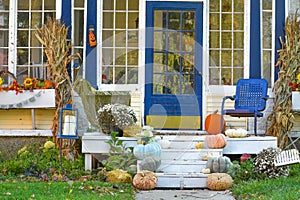 Fall Decorated Porch with Pumpkins and Blue photo