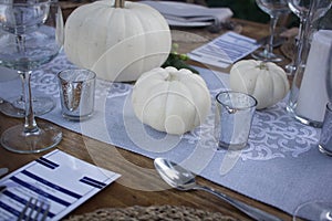 Elegant dinner table served on a garden photo