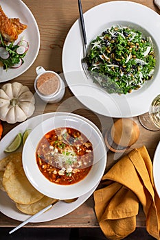 Fall dinner table overhead shot with salad and entrees